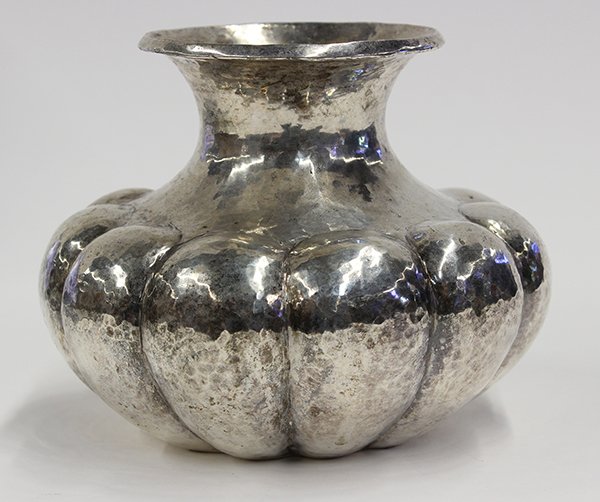 Mexican hand-hammered silver plate vase executed by Los: Mexican hand-hammered silver plate vase executed by Los Castillos, the compressed form forged with a flaring neck and lobing bulbous body, 5"h x 6"w