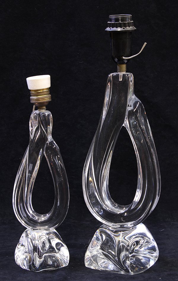 (lot of 2) Daum crystal table lamps: (lot of 2) Daum crystal table lamps, circa 1955, of twisted teardrop form and rising on twisted cube bases, each with an etched signature 'Daum France' with the cross of Lorraine, tallest 18"h