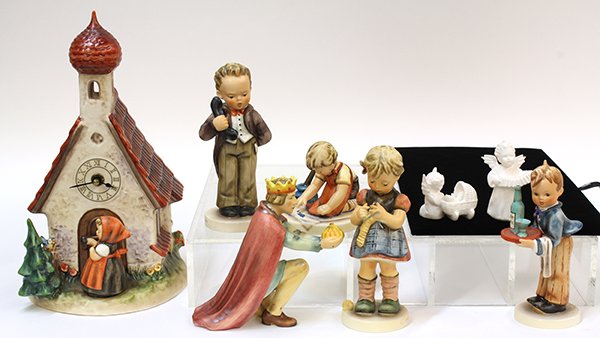 (lot of 8) Associated group of Hummel figurines: (lot of 8) Associated group of Hummel figurines, consisting of #309 'With Loving Greetings' tmk 6; #255 'Stitch in Time' tmk 6; #214/M 'King Kneeling; large nativity figure, tmk6; #154/0 'Waiter' tmk