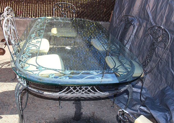 (lot of 9) Salterini wrought iron suite consisting of a: (lot of 9) Salterini wrought iron suite consisting of a glass top table, sideboard, six chairs, and tea cart