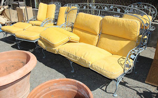 (lot of 9) Salterini wrought iron furniture group: (lot of 9) Salterini wrought iron furniture group, consisting of a settee, armchair, two lounge chairs with ottoman, floor standing ash tray, and two glass top occasional tables