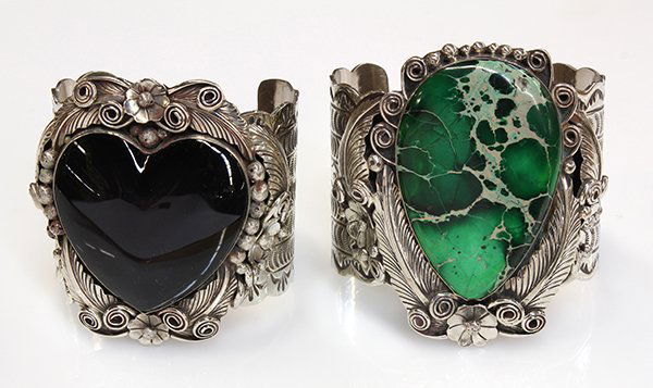 Collection of two Percy Spencer Native American bangle: Collection of two Percy Spencer Native American bangle braceletstwo large nickel silver bangles, one set with obsidian and one set with dyed green turquoise, both signed Percy Spencer