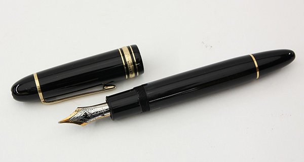 Montblanc Meisterstuck 149 fountain pen: Montblanc Meisterstuck 149 fountain pen, having a black resin cap and barrel with triple cap bands and gilt clip, the two colour broad nib no. 585, 5.5"l
