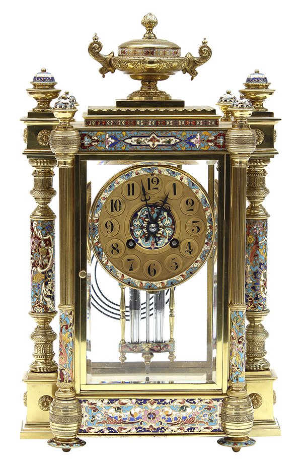 French champleve decorated mantle clock: French champleve decorated mantle clock, the brass case having an urn finial, above beveled glass panels and multi-color champleve inlay flanked with Corinthian columnar supports, having hinged door t