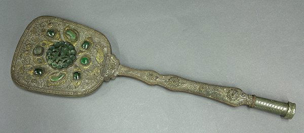Chinese Hand Held Mirror with Jade Inlay: Chinese export hand held filigree mirror with jade inlay, the back centered with a spinach green jade medallion pierced with flower and lingzhi, surrounded by various cabochons on a filigree tendril g