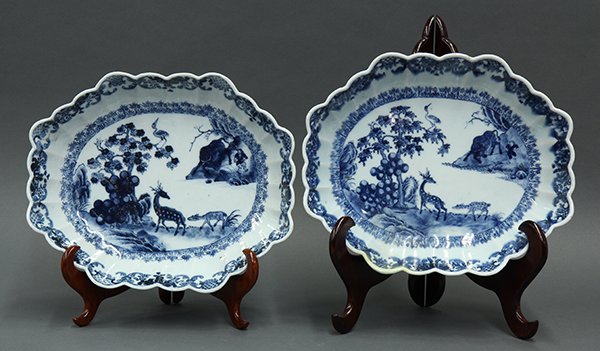 Two Chinese Blue and White Export Dishes: Pair of Chinese export porcelain serving dishes, the interior blue underglaze decorated with two deer under a tree, and a herder and ox across the river, the foliate rim edge accented with a leafy pat