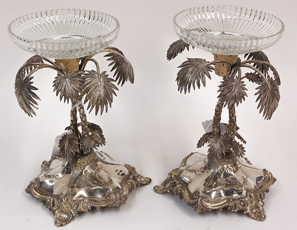 Pair of silver plate figural palm tree compotes: Pair of silver plate figural compotes, each centerpiece having sculpted palm trees raised on a polished quatrefoil base accented with finely hammered acanthaus scrolls, and fitted with a fluted presse