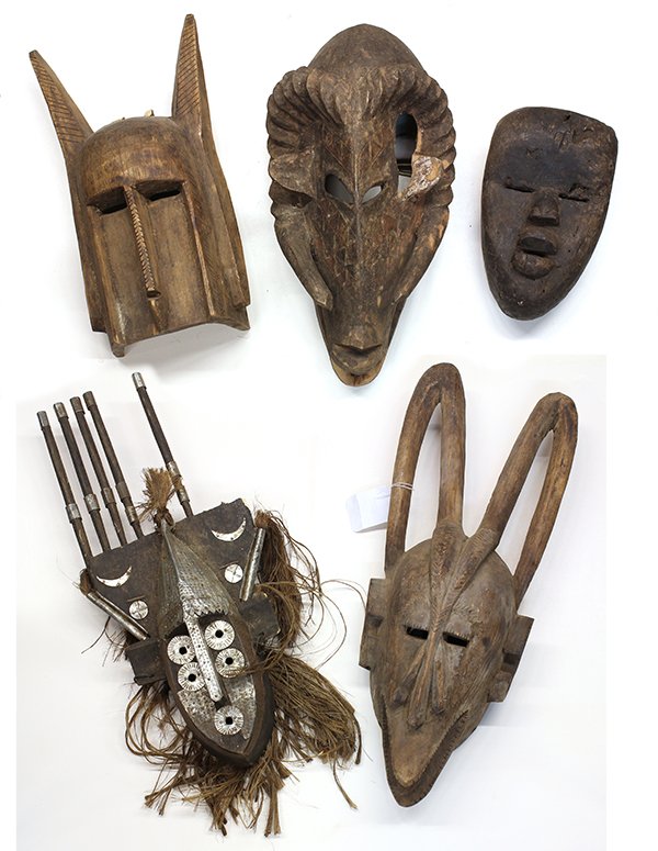 West African decorative carvings including Dogon style: (lot of 5) West African decorative carvings including Dogon style and Bambara style, Mali face and animal masks, largest; 24"l