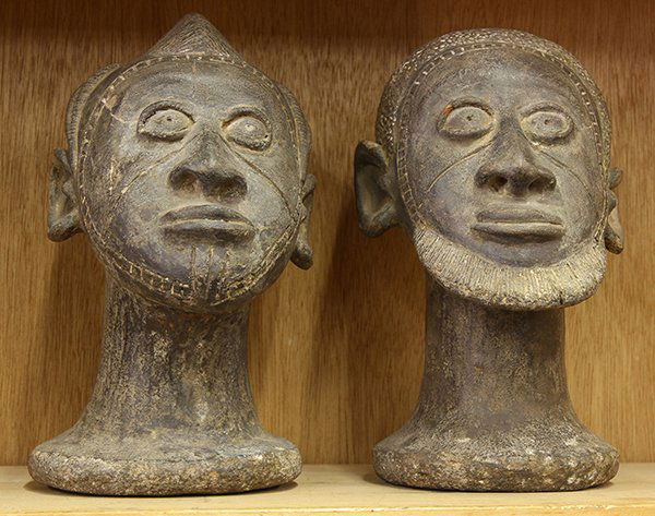 (lot of 2) West African modern-era stone male and: (lot of 2) West African modern-era stone male and female busts, probably Senufo style, Ivory Coast, 10"h.