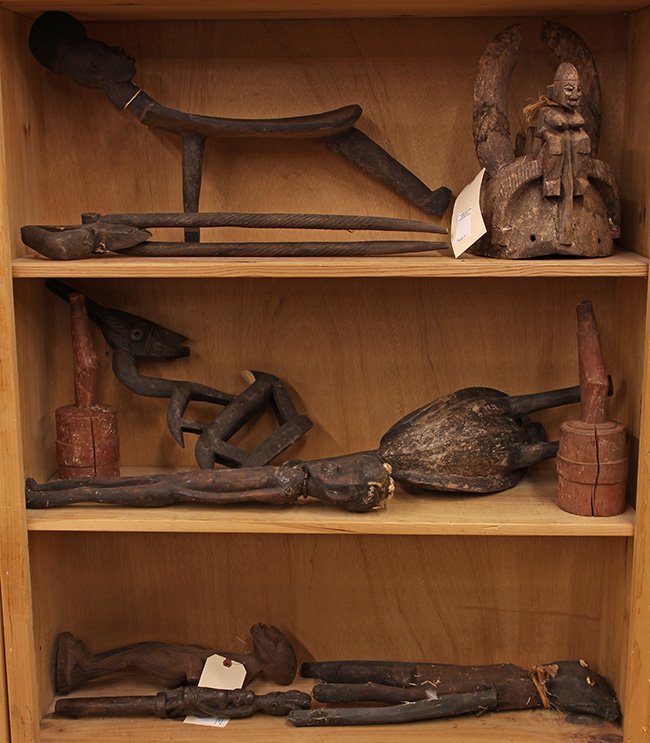 (lot of 11) West African decorative carvings including: (lot of 11) West African decorative carvings including a Dogon, Mali head dress surmounted with ancestral figures, and a figural stool; Senufo, Ivory Coast bird and doll figure; Chi-Wara dance crest (