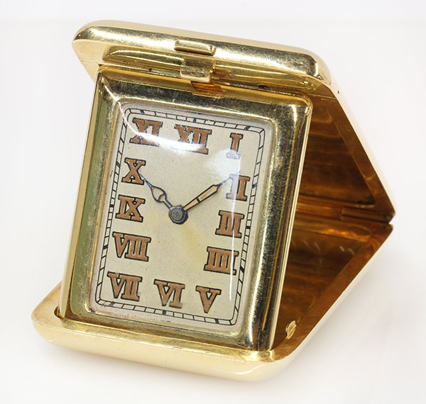 Swiss 18k yellow gold folding travel clock: Swiss 18k yellow gold folding travel clock Dial: silvered with Roman numerals, spade hands; Movement: Lagget Swiss, 17 jewel manual wind; Case: 18k yellow gold plain folding, 2" x 1 1/2", inside case 