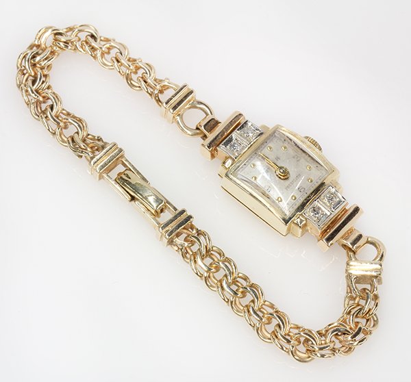 Lady's retro diamond, 14k yellow gold wristwatch: Lady's retro diamond, 14k yellow gold wristwatch Dial: silvered with dot indexes, marked Gruen, Movement: quartz converted, Case: marked Gruen, inside marked 258778, (4) single cut diamonds totaling a