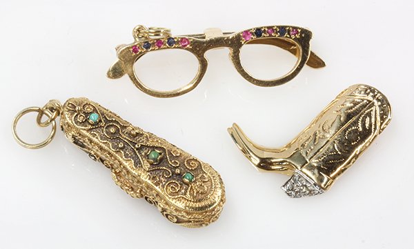 (Lot of 3) 14k yellow gold jewelry items: (Lot of 3) 14k yellow gold jewelry items comprised of a 14k yellow gold and turquoise violin case charm which opens to reveal a movable violin charm; a ruby, sapphire and 14k yellow gold eye glass cha