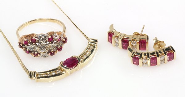 Collection of ruby, diamond and 14k yellow gold jewelry: Collection of ruby, diamond and 14k yellow gold jewelry comprised of one ruby, diamond and 14k yellow gold necklace; one pair of ruby, diamond and 14k yellow gold earrings, together with a synthetic r