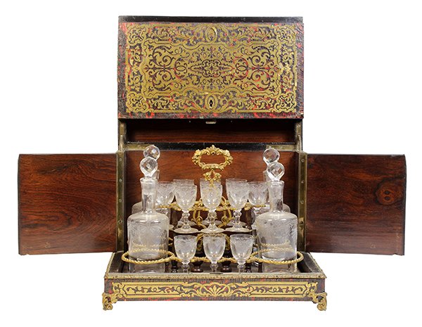 Napoleon III boulle tantalus: Napoleon III boulle tantalus, circa 1870, the boulle inlaid exterior having a hinged top with a gilt decorated border, opening to reveal the fitted interior having (11) cordials and (4) decanters, eac