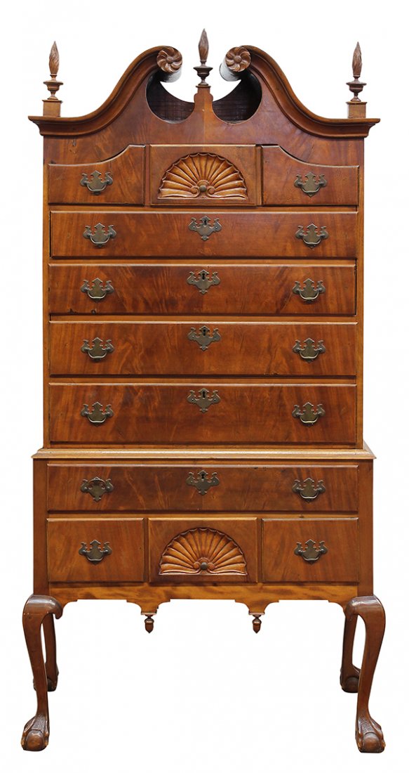 Chippendale bonnet top high-boy: Chippendale bonnet top high-boy, late 18th or early 19th century, executed in mahogany, having a broken arch crest with flower terminals, surmounted by three flame finials, above frieze drawers center