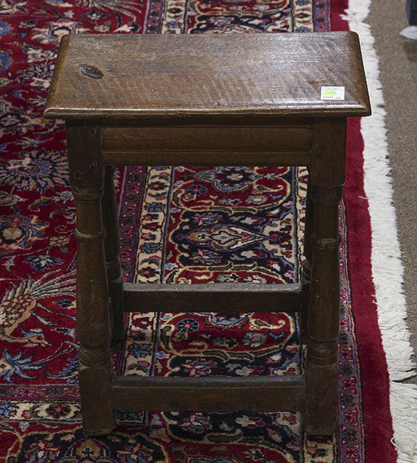 Jacobean stool, possibly 18th century, having a: Jacobean stool, possibly 18th century, having a rectangular top, above the carved apron, and rising on turned legs, 22"h x 18"w x 11"d. Provenance: From the Pebble Beach, CA estate of Richard Mellon S