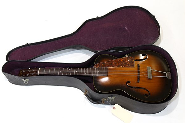 1937 Martin C-1 arch top guitar, having an Adirondack: 1937 Martin C-1 arch top guitar, having an Adirondack red spruce top, mahogany back and sides, rosewood fingerboard, Grover g-98 tuners, and original case (Model R-18 serial number 67428), case: 5.5"h