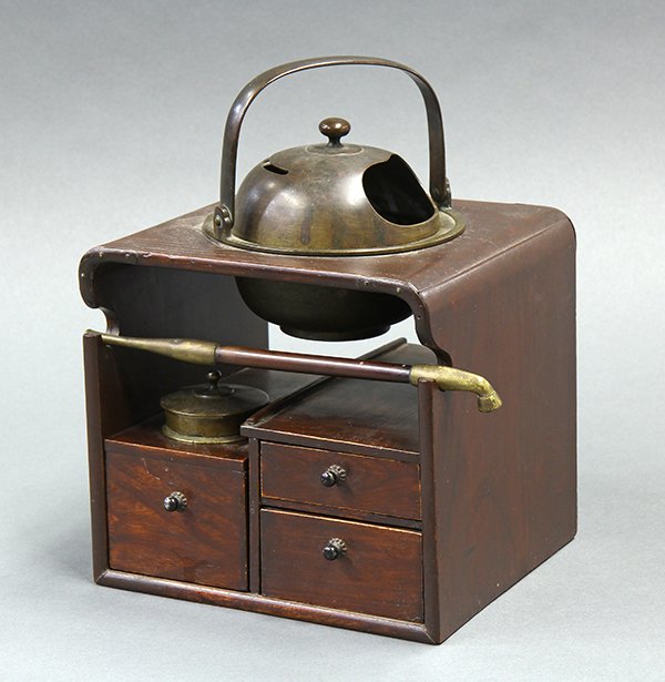 Japanese Tobacco-bon Set, 19c: Japanese tobacco-bon set of mulberry wood and bronze, 19th century, two drawers on the right, tobacco container on the left, hiire (hibachi) with a handle on the top, together with a kiseru pipe, 8.25