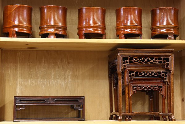 Group of Chinese Stands, Bamboo Containers: (lot of 9) Chinese wooden stands, consisting of a set of three nesting stands, with a pierced apron; a rectangular stand inset with a marble plaque; together with five bamboo containers, largest stand