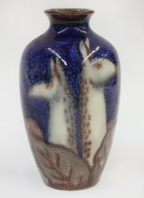 Jens Jensen for Rookwood vase: Jens Jensen for Rookwood vase, 1933, executed in Ivory Jewel glaze, the shouldered form decorated with five stylized llamas on a mottled cobalt ground, having an impressed flame mark, with year, XXXII