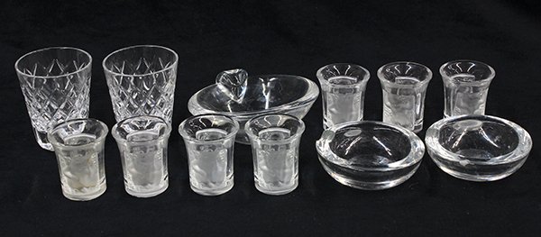 (lot of 12) Group of crystal table articles: (lot of 12) Group of crystal table articles, consisting of (7) Lalique shot glasses each decorated with Bacchanalian figures in frosted glass on a clear ground, a pair of Cartier shot glasses, a Steub