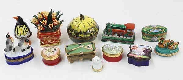 (lot of 12) Collection of mostly Limoges polychrome: (lot of 12) Collection of mostly Limoges polychrome painted porcelain pill boxes, in various shapes including penguins, ducks, a locomotive, a rabbit, a pool table, etc. largest: 3.5"h Provenance: Fro
