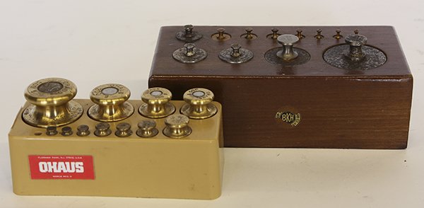 Two sets of scale weights: Two sets of scale weights, including one by Ohaus, each in fitted stand, largest: 3.25"h x 7.25"w x 3.75"d