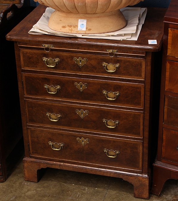 English burl walnut chest of drawers, the rectangular: English burl walnut chest of drawers, the rectangular top above a brushing slide and four graduated drawers, 29"h x 25.5"w x 19.5"d. Provenance: From the Pebble Beach, CA estate of Richard Mellon Scai