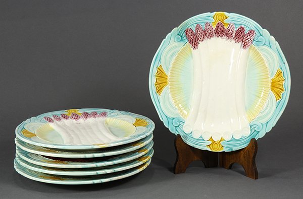 (lot of 6) French majolica asparagus plates, possibly: (lot of 6) French majolica asparagus plates, possibly by Orchies, the relief decorated plates centering a cluster of asparagus spears in white with lavender tops, and surrounded by the yellow border, 