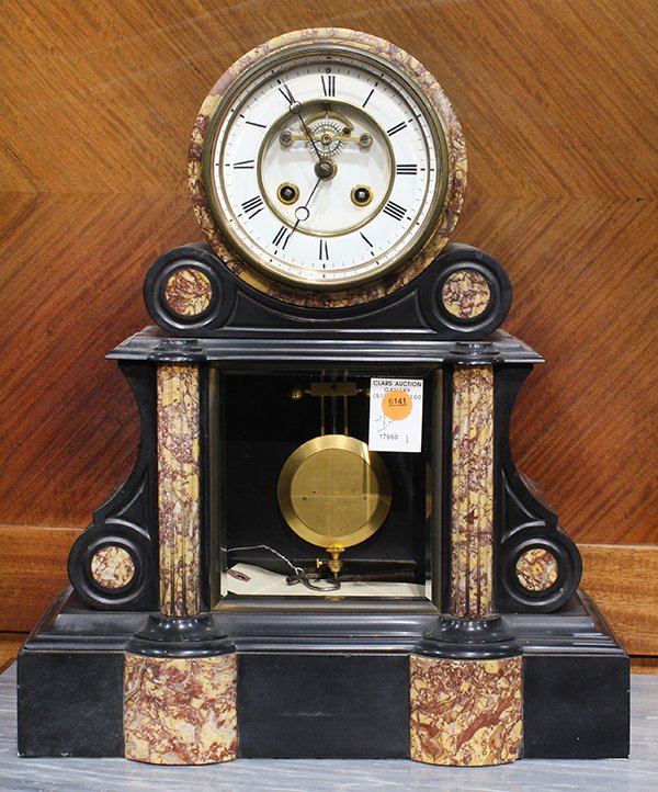 French Neoclassical style slate and marble mantle clock: French Neoclassical style slate and marble mantle clock, having a Roman numeral enamel dial, above the case with Classical style architectural elements, having columnar supports centering a beveled gl