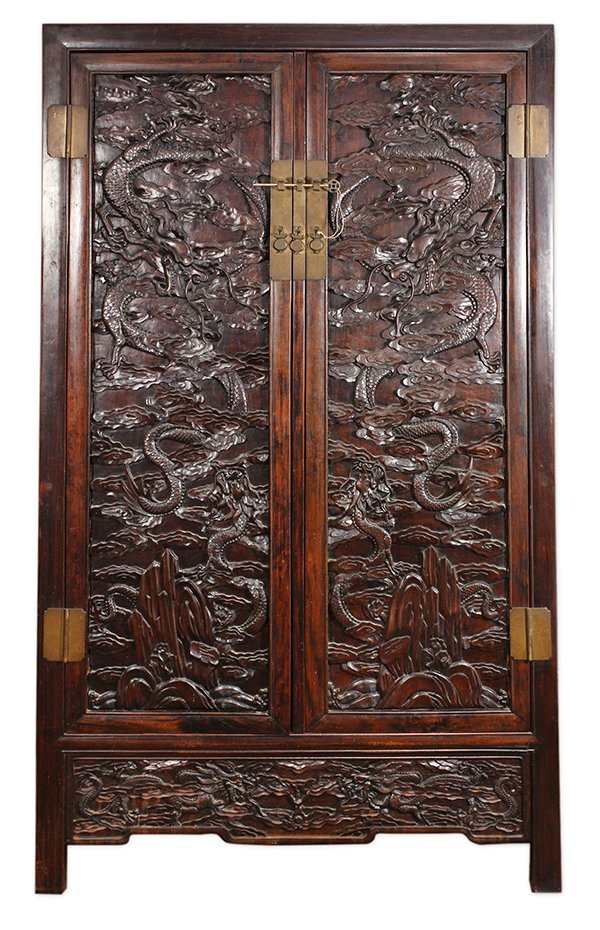 Chinese Rosewood Dragon Cabinet: Chinese rosewood cabinet, 19th century, fronted by hinged double doors, each with a large meandering dragon above a smaller one, with the motif repeated on the apron, raised on straight bead edge supp