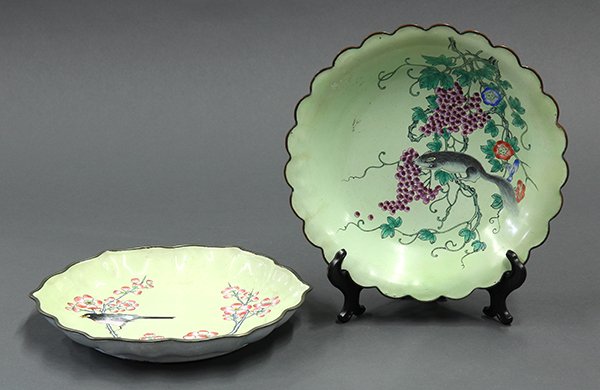 Two Chinese Enamel Dishes: (lot of 2) Chinese painted enamel metal dishes, one decorated with a squirrel and grapes on a green ground with foliate rim; the other with a bird and prunus on a yellow ground, 8.75"w