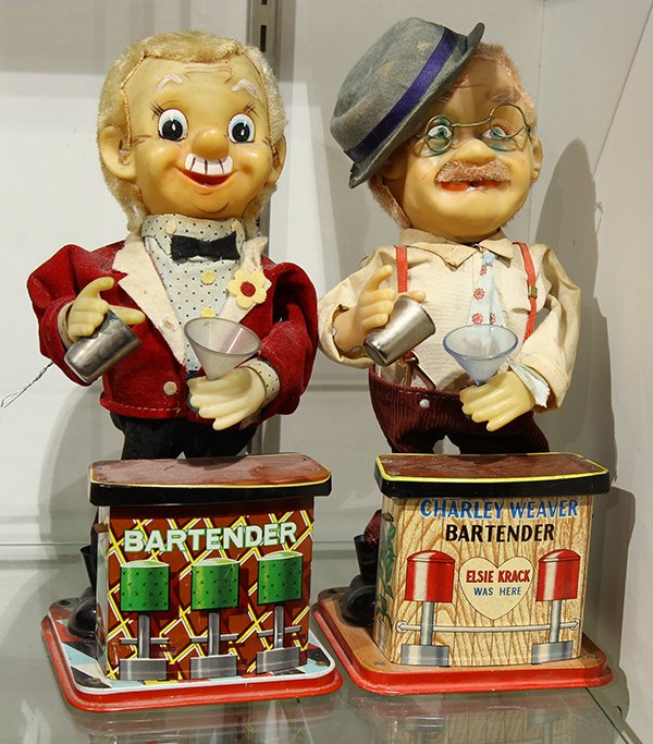 (lot of 2) Vintage battery operated bartender toys: (lot of 2) Vintage battery operated bartender toys, one marked "Charlie Weaver", each carrying a cocktail shaker and glass, largest: 12.5"h