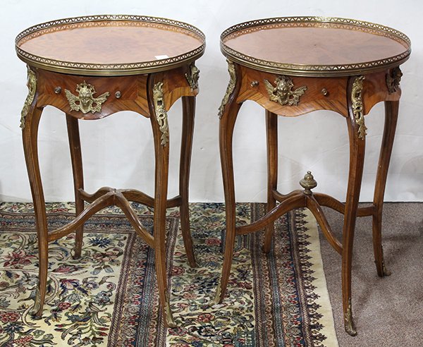 Pair of French Louis XVI style gueridons: Pair of French Louis XVI style gueridons, each having a gallery top, above the shaped apron, having ormolu figural mounts, and rising on cabriole legs terminating on sabots, 30"h x 20"dia.