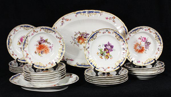 (lot of 26) KPM porcelain table service, the partial: (lot of 26) KPM porcelain table service, the partial gilt border with garland swags on a white ground, accented with cobalt blue, centering polychrome floral decoration, consisting of two serving tray