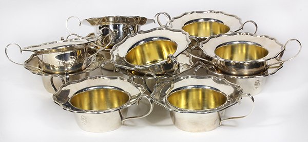 Shreve & Company sterling silver-gilt consomme bowls,: (lot of 12) Shreve & Company sterling silver-gilt consomme bowls, each having a scalloped border, and loop handles, 36.76 troy oz. Provenance: From the Pittsburgh, PA Estate of Richard Mellon Scaife