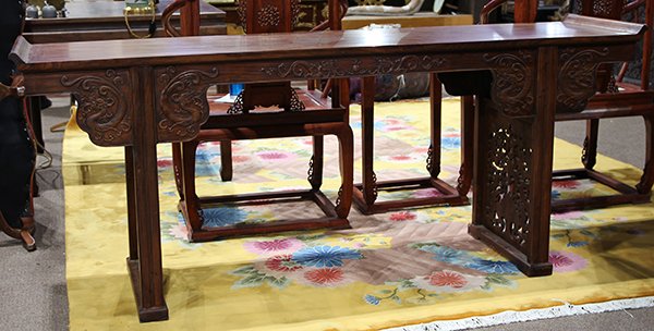 Vietnamese Huanghuali Altar Table, Dragons: Vietnamese huanghuali altar table, the top with two floating panels flanked by swallow tail flanges, the apron and spandrel carved with dragons, the side panel pierced with dragons and ruyi head, 33.5
