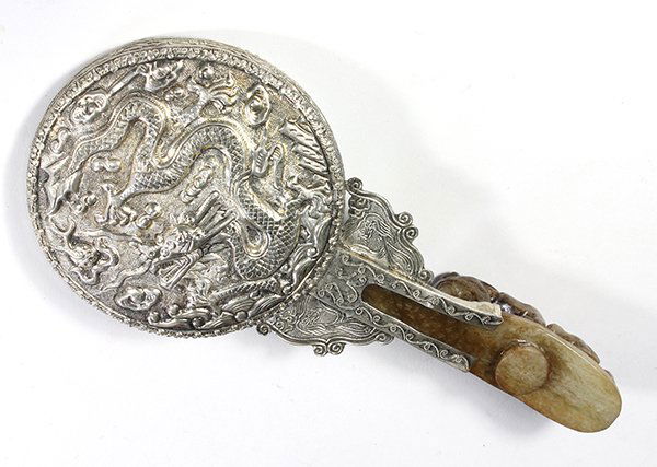 Chinese Hand Held Mirror, with Belt Hook Handle: Chinese hand held mirror, the back with a repousse dragon, mounted onto a hardstone belt hook carved with a dragon and chilong, 9"w