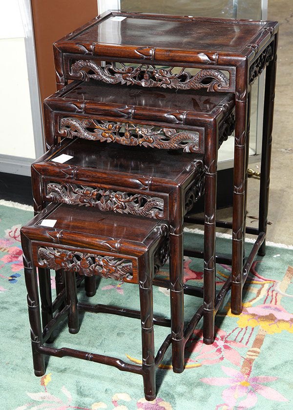 Set of Chinese Nesting Tables: Set of four Chinese nesting tables, with a faux bamboo edge and supports, the apron pierced with meandering dragons, largest: 28"h