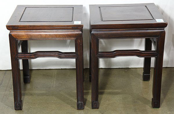 Two Chinese Wood Stands/Stools: Pair of Chinese wood stands/stools, each with a floating top panel, with a plain bead edge apron above humpback stretchers, raised on supports with hoof terminals, 18"h x 14"sq