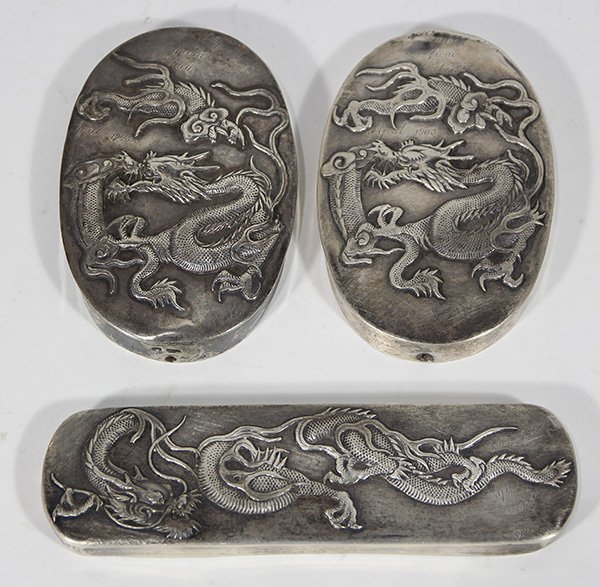 Chinese Export silver garment and shoe brush mountings: (lot of 2) Chinese Export silver garment and shoe brush mountings by Wang Hing, Hong Kong, late 19th/early 20th century, each having a polished surface and featuring a writhing dragon, each inscribed 