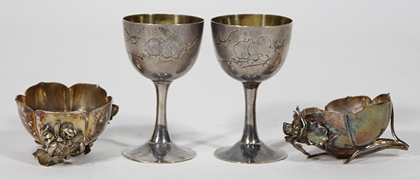 Chinese Export silver cordials and open salts: (lot of 4) Pair of Chinese Export silver cordials, each decorated with a song bird flying over cherry blossoms, and presented to Lt. Col. H.R. Thorpe; together with a pair of figural open salts, each 