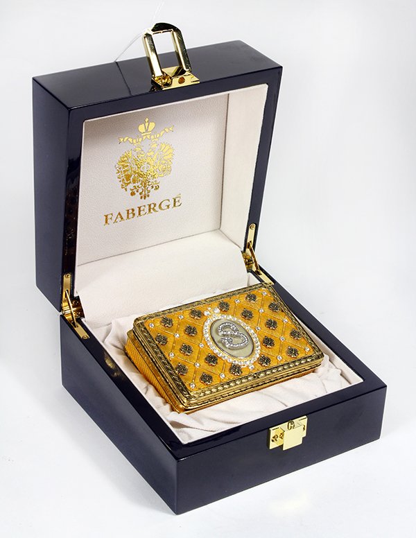 Faberge gilt trinket box, accented with rhinestones and: Faberge gilt trinket box, accented with rhinestones and having a monogram "S", in a fitted case, case: 3.5"h x 5.5"dia. Provenance: From the Pittsburgh, PA estate of Richard Mellon Scaife