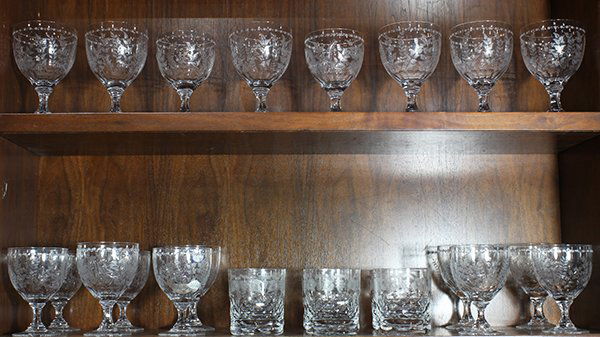 (lot of 24) William Yeoward etched stemware: (lot of 24) William Yeoward etched stemware, consisting of (18) goblets in two sizes, each decorated with foliage, largest: 6.25"h; and (6) tumblers, decorated with grape vines, 4.25"h. Provenance: Fr