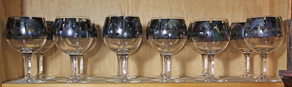 (lot of 12) One shelf of barware in the Art Nouveau tas: (lot of 12) One shelf of barware in the Art Nouveau taste, of balloon form with polychrome decoration depicitng nymphs and peacocks, rising on tapering stems and resting on circular feet, 7.75"h. Prov