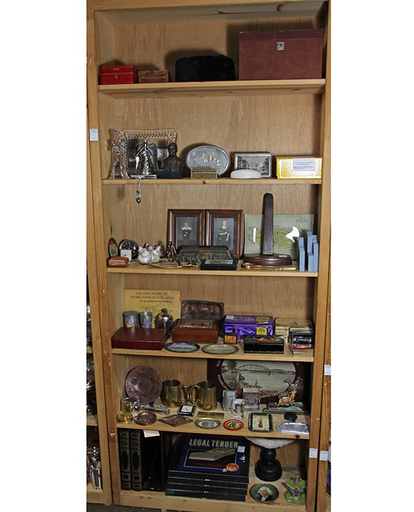 Six shelves of associated vintage metal, desk, and: Six shelves of associated vintage metal, desk, and gambling accessories, including (3) leather bound traveling jewel cases, a Lenox crystal cross, a Waterford crystal frame, a candy tin from the maide