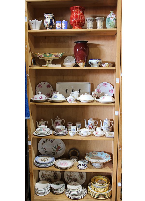Six shelves of porcelain and table accessories,: Six shelves of porcelain and table accessories, including a Sampson vase with hand panted bird reserves on a cobalt ground, an Italian Shell form coffee cup, circa 1780, the interior painted with rose