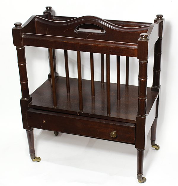 Victorian style walnut canterbury, having three divider: Victorian style walnut canterbury, having three dividers, and rising on tapered legs terminating on casters, 20.5"h x 16.5"w x 10"d. Provenance: From the Pittsburgh, PA estate of Richard Mellon Scaife