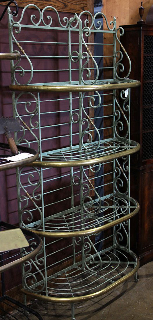 French brass and green painted iron bakers rack, having: French brass and green painted iron bakers rack, having a tiered form with scroll accents flanking the oval shelves, 70.5"h x 36"w x 14.5"d